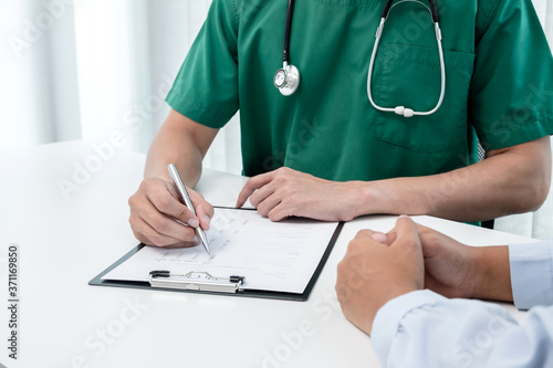 Male doctors explain and recommend treatment after a female patient meets a doctor and receives results regarding illness problems. Medical and health care concepts