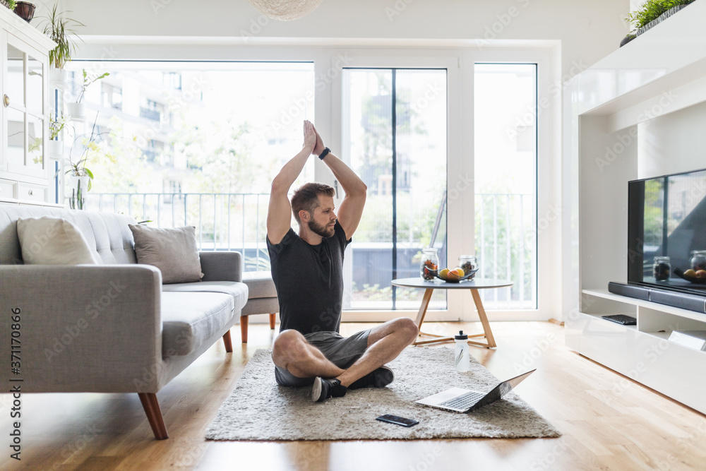 Handsome man working out at home Handsome man working out at home