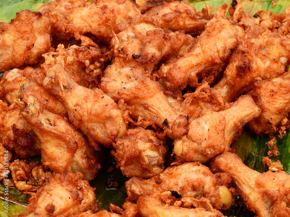 Fried chicken calves on banana at street food Thailand Fried chicken calves on banana at street food Thailand