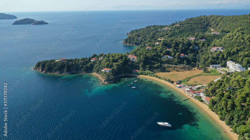 Aerial drone photo of famous seaside area and bay of Kanapitsa with many beautiful secluded sandy beaches, Skiathos island, Sporades, Greece