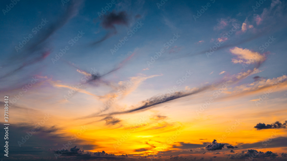 Beautiful sunset sky over the sea. Blue sky and bright sunrise sunset over the horizon.