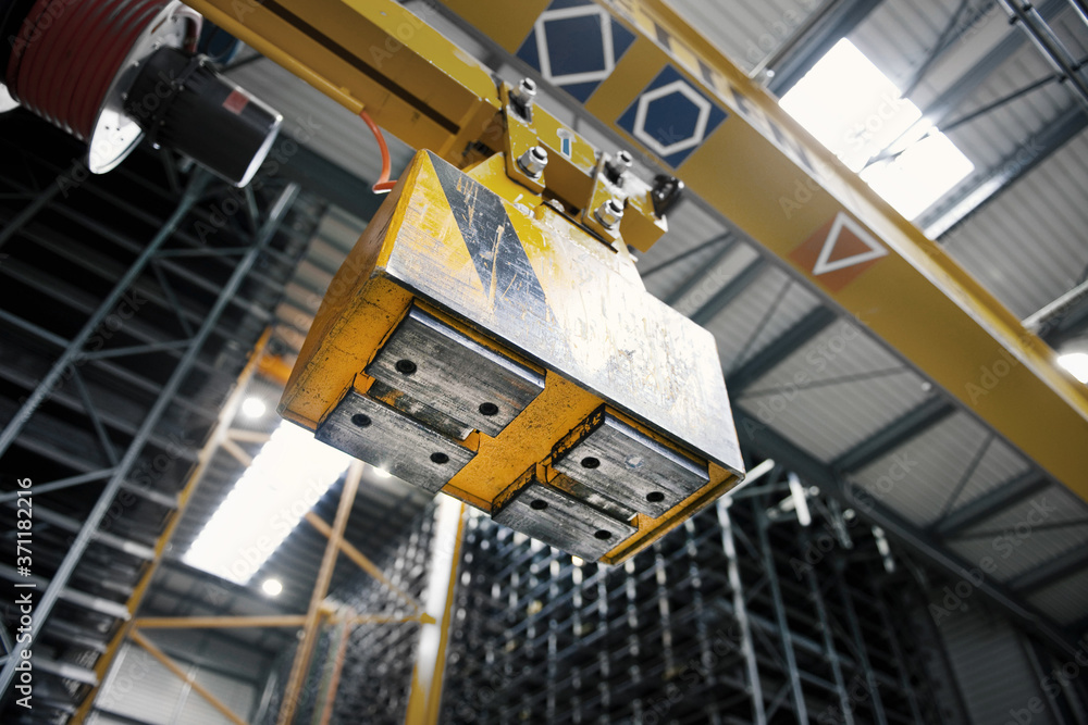 Industrial electromagnet in the high rack for steel shipping Industrial electromagnet in the high rack for steel shipping