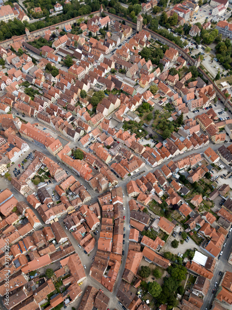 ROTHENBURG OB DER TAUBER / GERMANY - JULY 29 2018: Aerial view Rothenburg old town fairy tale german Bavarian city with half-tembered medieval architecture Old street brown roofs houses cityscape.