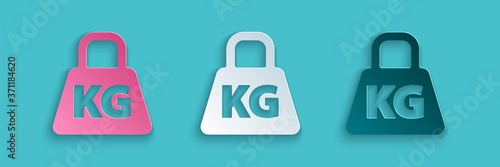 Paper cut Weight icon isolated on blue background. Kilogram weight block for weight lifting and scale. Mass symbol. Paper art style. Vector Illustration.
