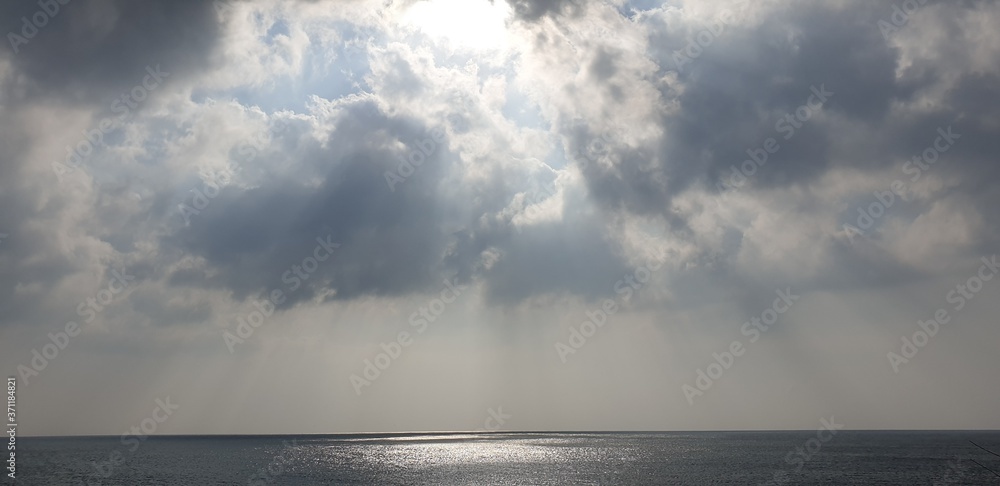 Sun light in the clouds of the korean sea