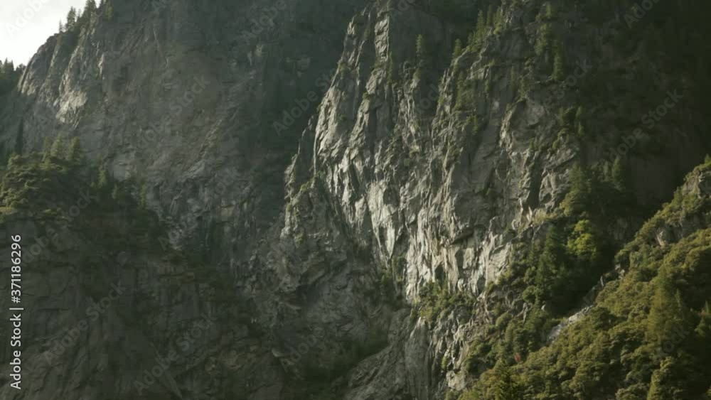 Slow Pan Down View Of Cliffs Down To Merced River In Yosemite. Follow Shot Slow Pan Down View Of Cliffs Down To Merced River In Yosemite. Follow Shot