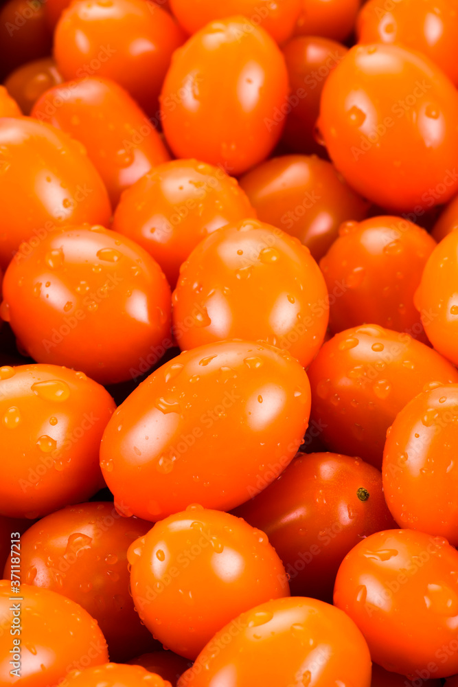 Close-up of fresh cherry tomatoes as a background Close-up of fresh cherry tomatoes as a background