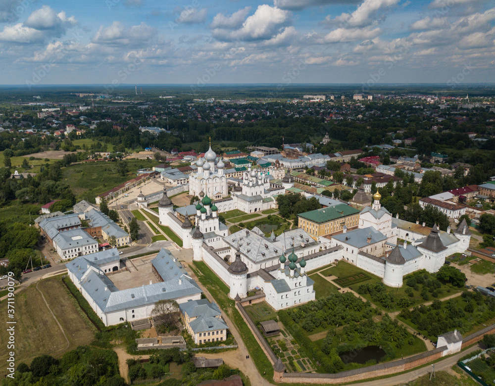 Fototapeta premium Aerial summer view of white old monastery with silver domes in Rostov the Great city. Russia