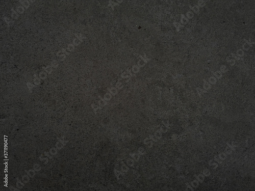 Granite stone nature granitoids rough honed surface finished wall, floor material black and gray color background, Always has a tight texture, durable