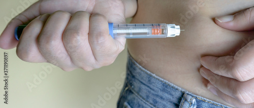 Diabetic patient makes an insulin injection. Treatment and control diabetes concept