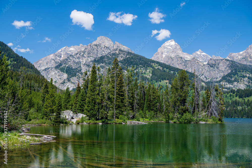 Taggart Lake is located in Grand Teton National Park, in the U. S. state of Wyoming. The natural lake is located at the terminus of Avalanche Canyon. A number of hiking trails can be found here.