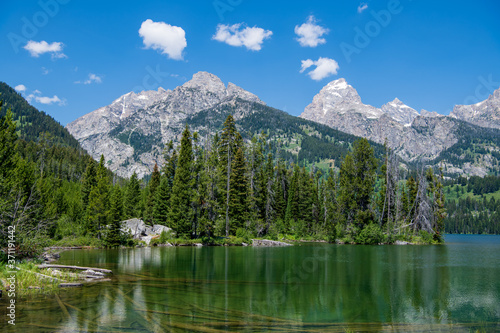 Taggart Lake is located in Grand Teton National Park, in the U. S. state of Wyoming. The natural lake is located at the terminus of Avalanche Canyon. A number of hiking trails can be found here.