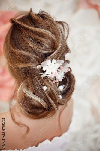 Closeup of Bridal wedding hairstyle with jewelry wreath. Back view. Elegant bride with Wavy hair.
