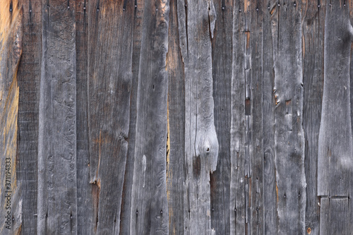 Wood texture. A fragment of a fence made of old wooden boards.