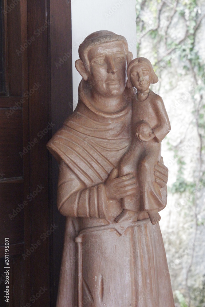 Naklejka premium São Francisco de Assis, escultura de barro, menino Jesus