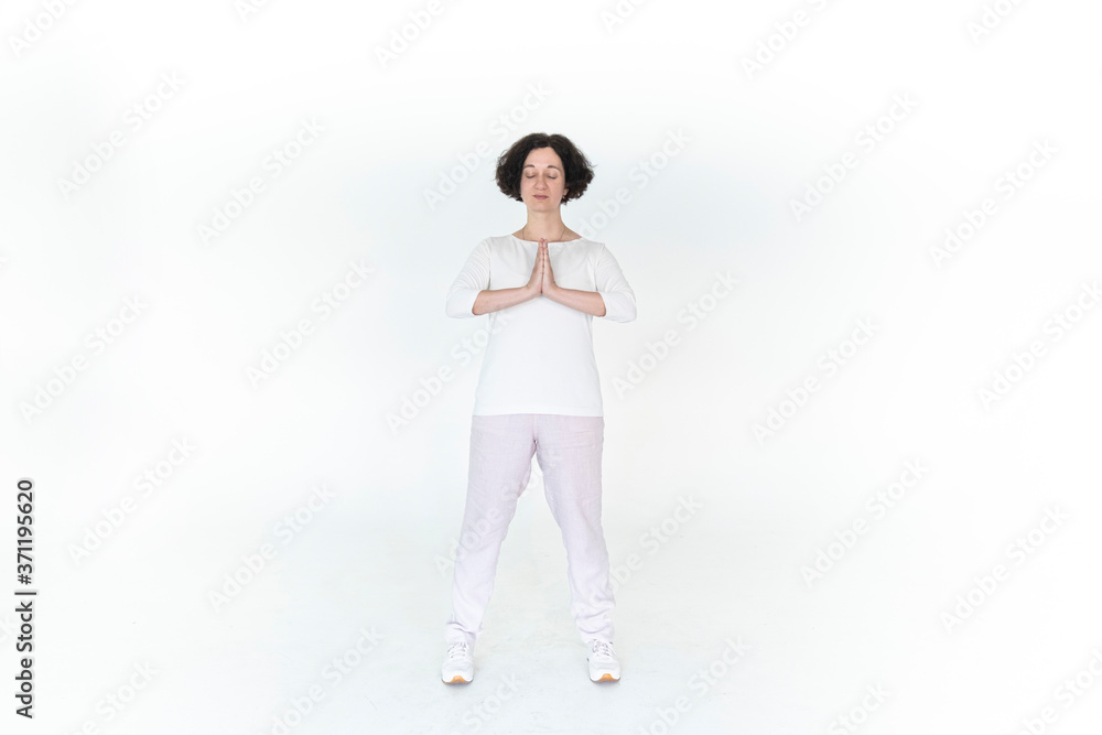woman practicing qi qong at white studio traditional chinese gymnastics woman practicing qi qong at white studio traditional chinese gymnastics