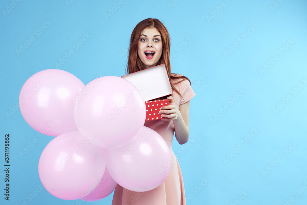 Beautiful woman with pink balloons holiday fun birthday Gift happiness blue background Beautiful woman with pink balloons holiday fun birthday Gift happiness blue background