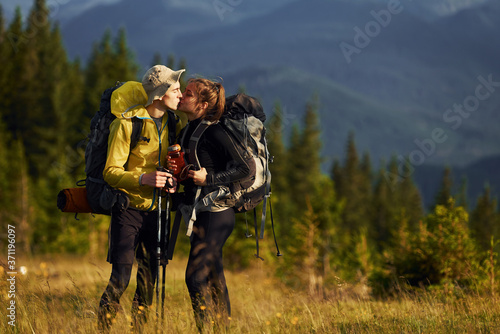 Cute young couple. Majestic Carpathian Mountains. Beautiful landscape of untouched nature