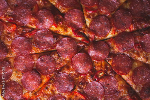 Flat lay of Italian pepperoni pizza. macro shot. Pizza textured background