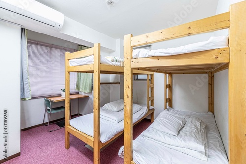 Canvastavla Two Bunk bed and mattress in guest house room