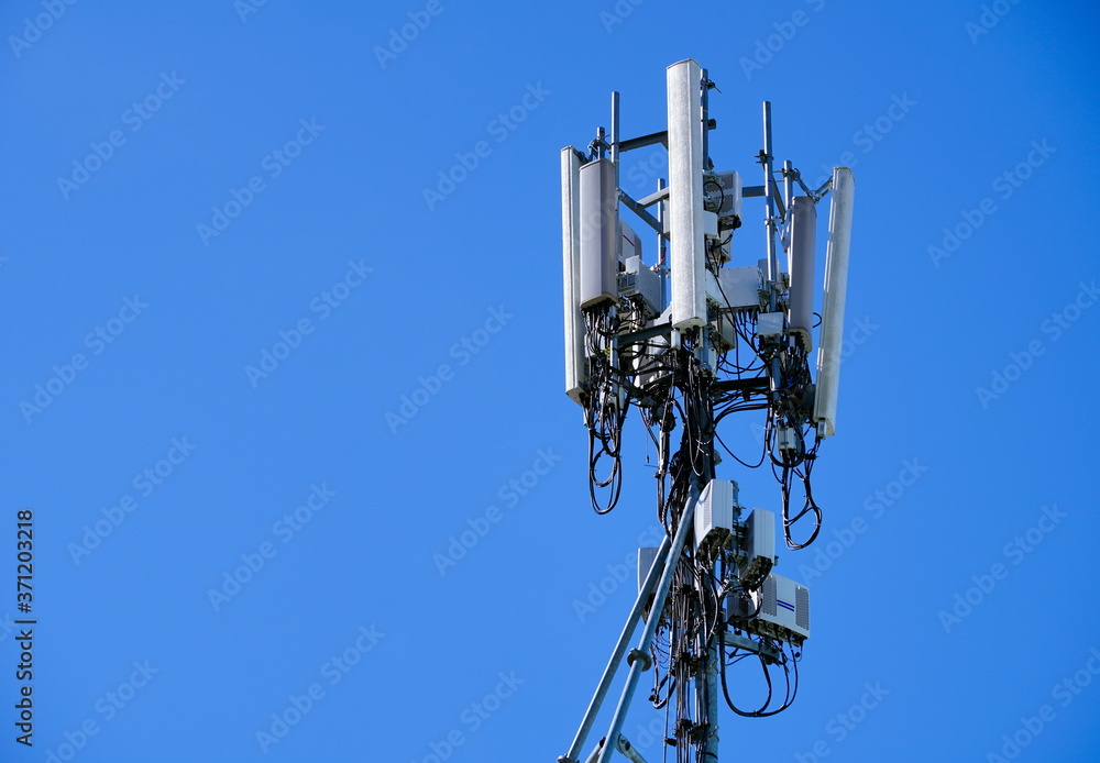 Telecommunication pole of 4G and 5G cellular. Base Station or Base Transceiver Station. 5G radio network telecommunication equipment with radio modules and smart antennas mounted on a metal. Telecommunication pole of 4G and 5G cellular. Base Station or Base Transceiver Station. 5G radio network telecommunication equipment with radio modules and smart antennas mounted on a metal.