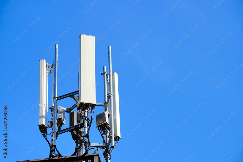 Telecommunication pole of 4G and 5G cellular. Base Station or Base Transceiver Station. 5G radio network telecommunication equipment with radio modules and smart antennas mounted on a metal. Telecommunication pole of 4G and 5G cellular. Base Station or Base Transceiver Station. 5G radio network telecommunication equipment with radio modules and smart antennas mounted on a metal.