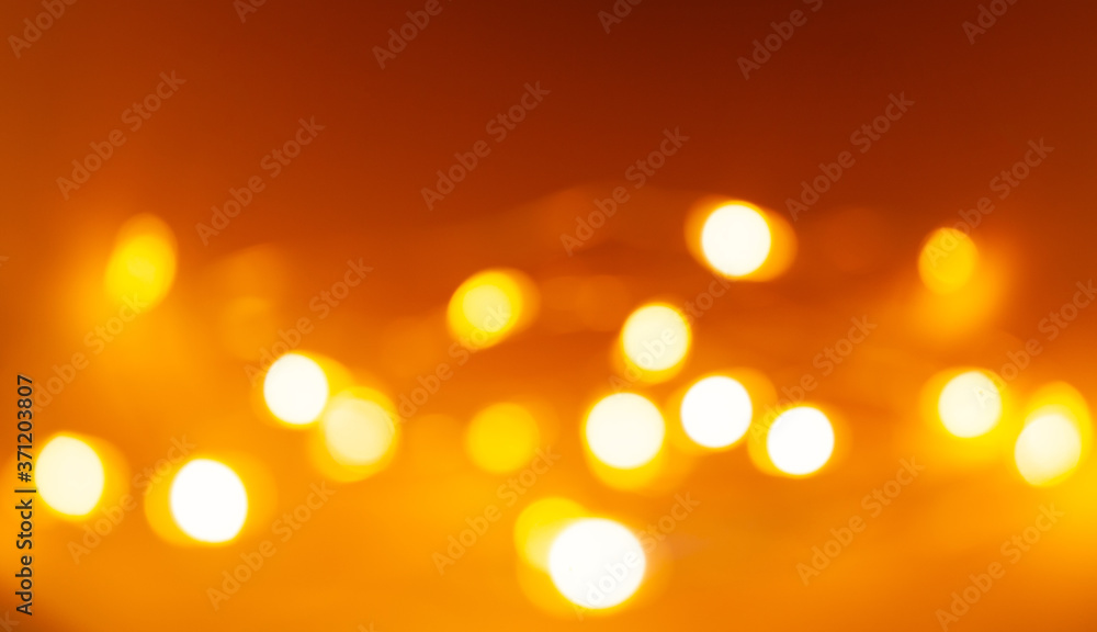 orange background with yellow blurred lights orange background with yellow blurred lights