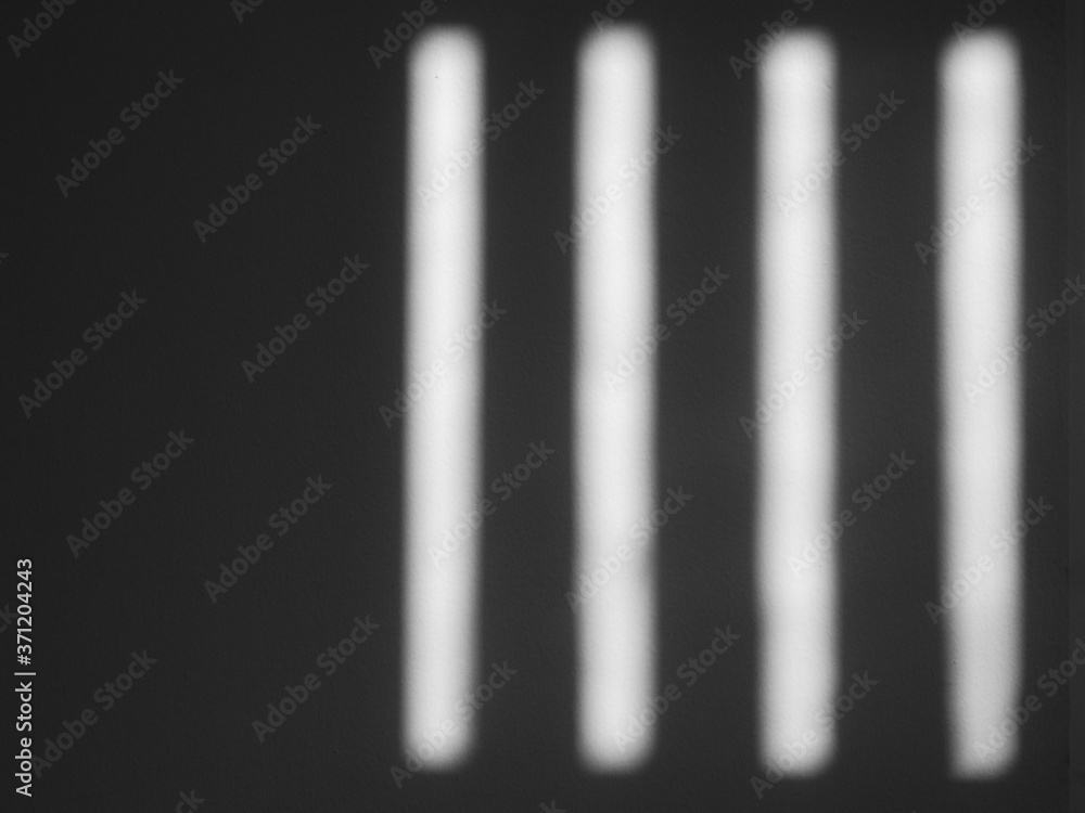 shadow on white wall with light from the window in the room shadow on white wall with light from the window in the room