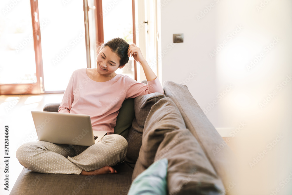 Fototapeta premium Attractive young asian woman using laptop computer