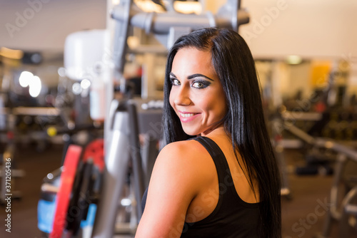 Portrait of a beautiful young girl working out in the Gym