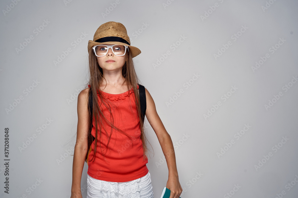 little girl wearing hat schoolgirl learning education red t shirt little girl wearing hat schoolgirl learning education red t shirt