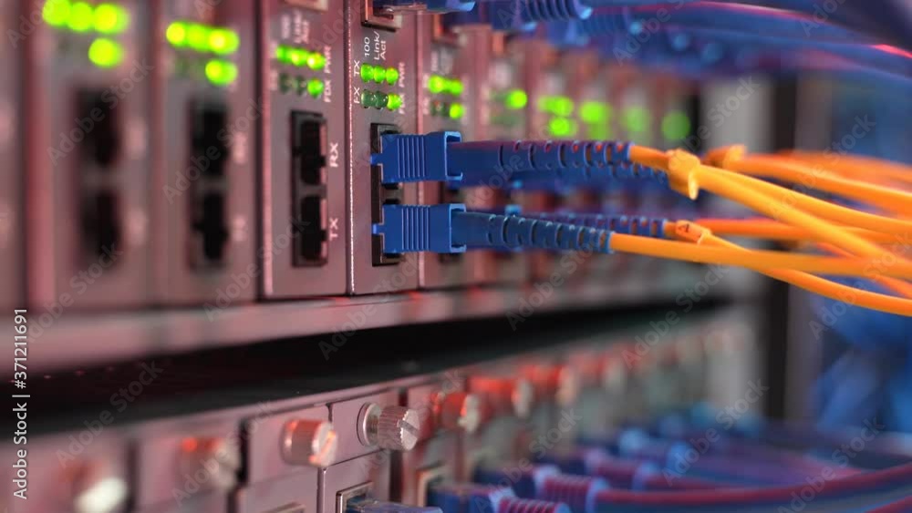 Vídeo do Stock: Fiber Optic cables connected to an optic ports and ...