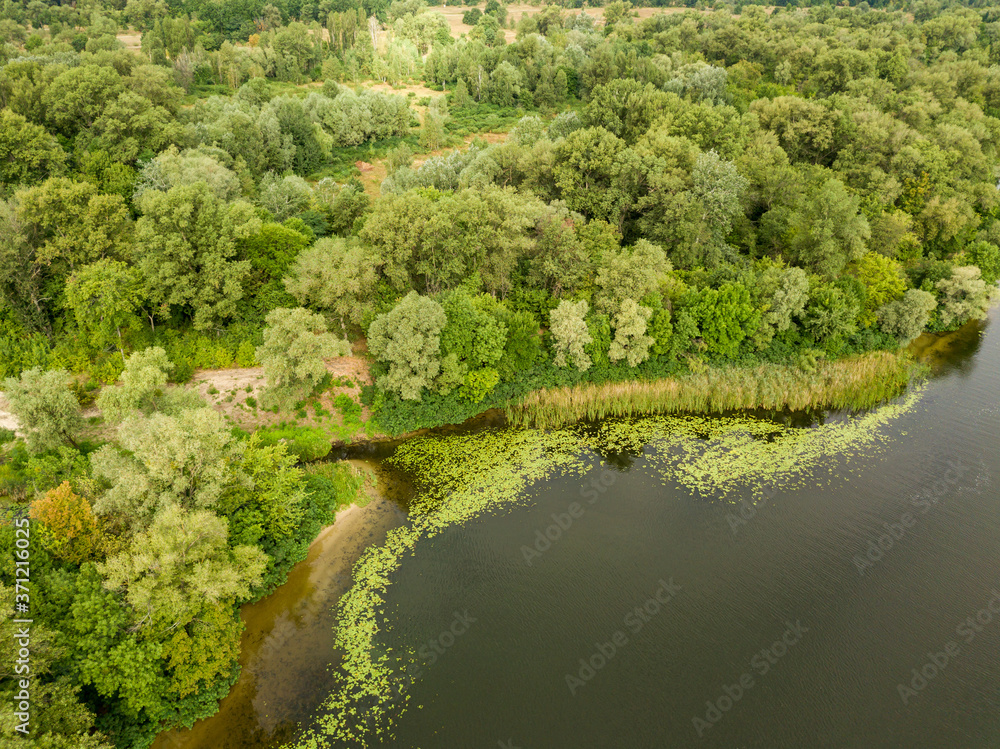 Aerial view. Green bank of the Dnieper river on a summer day. Aerial view. Green bank of the Dnieper river on a summer day.