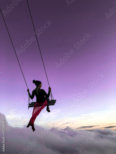 Woman on the swing conveying peace and tranquility