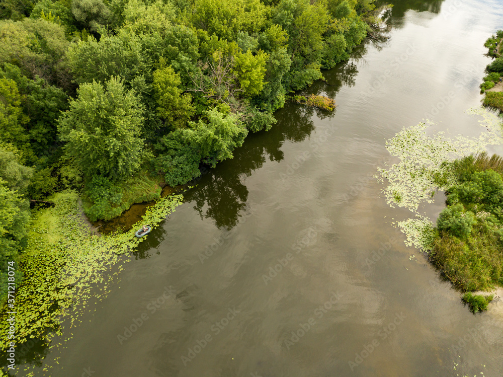 Aerial view. Green bank of the Dnieper river on a summer day. Aerial view. Green bank of the Dnieper river on a summer day.