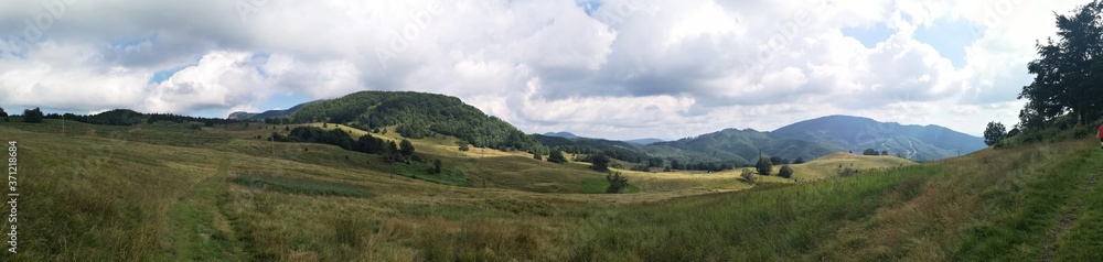 Fototapeta premium Mountain landscape with clouds - Gutai mountains , Maramures, Creasta Cocosului, Cock's comb