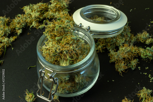 Legal commercial cannabis business online. Delivery of marijuana, weed in jar