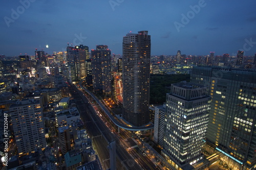 Modern business district with skyscrapers in Tokyo at night