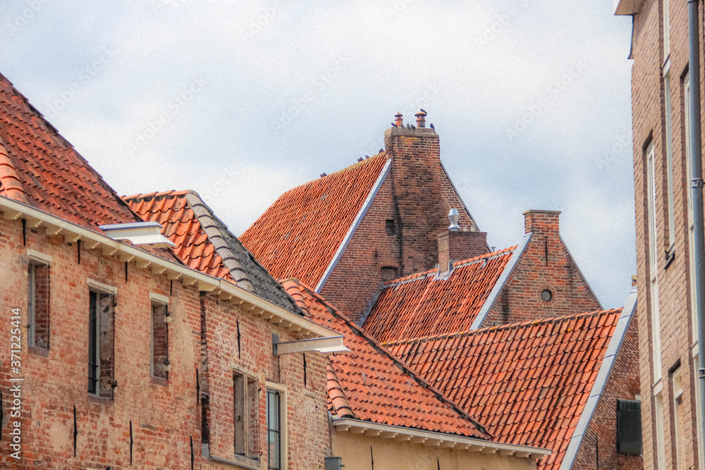 Deventer, Netherlands - July 11 2020: Ancient Facade of old style houses in the center of town.