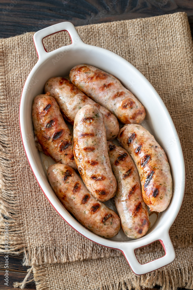 Grilled sausages on baking tin Grilled sausages on baking tin