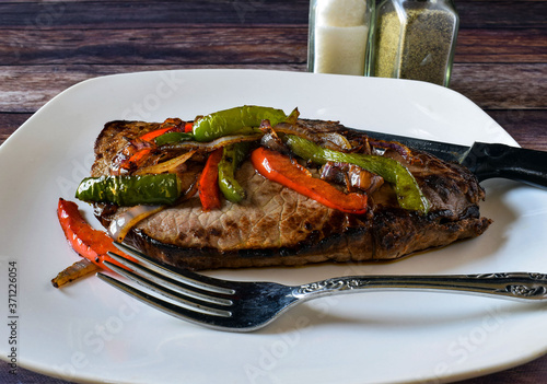 steak with onions and peppers