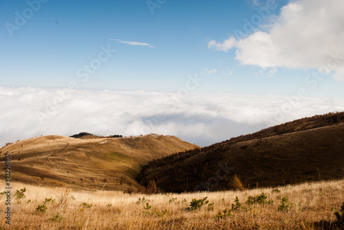 Clouds and alpine meadows in Caucasus mountains in autumn