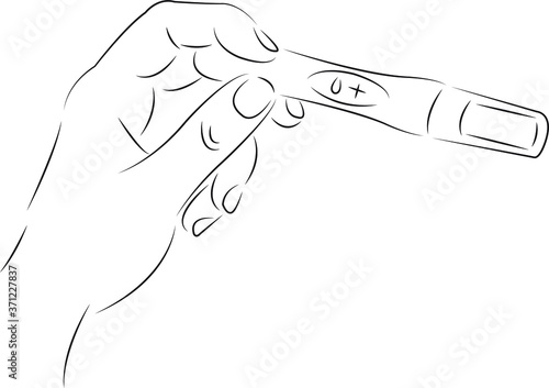 hand with a pregnancy test