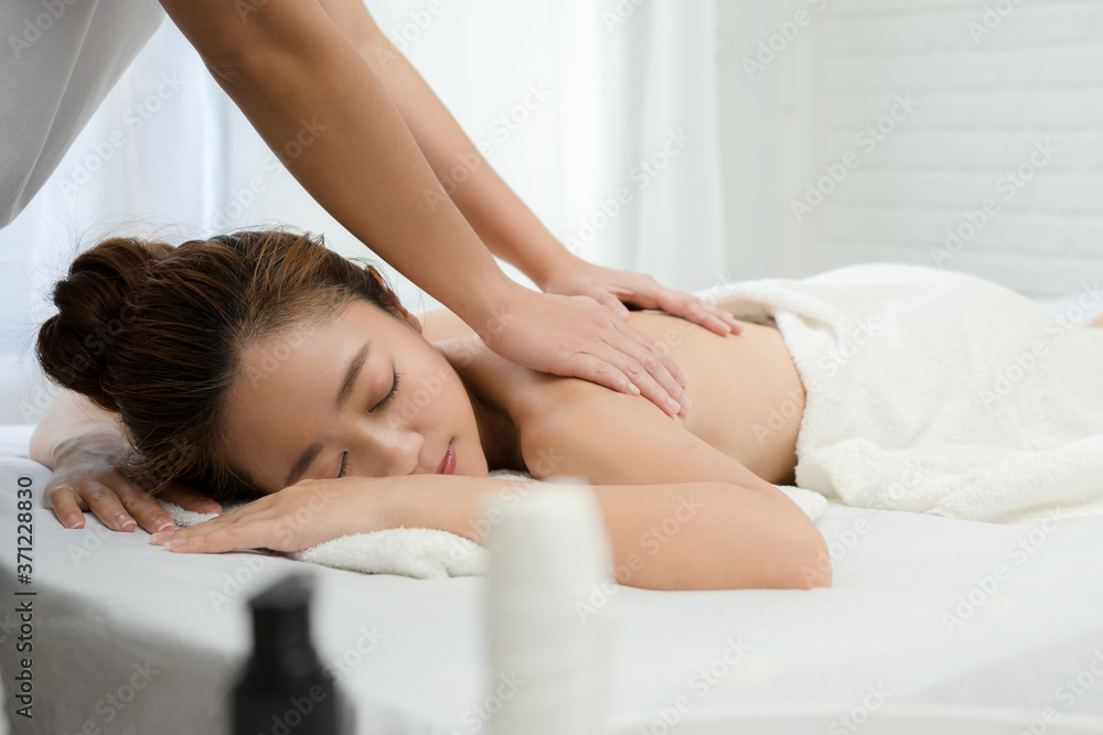 Beautiful Asian woman relaxing with hand massage at beauty spa. Beautiful Asian woman relaxing with hand massage at beauty spa.