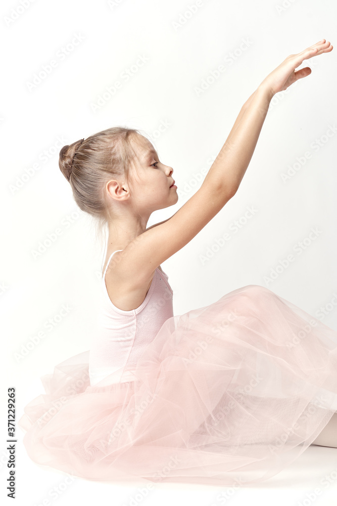 Girl ballerina in pink dance costume ballet dance pointe shoes tutu light background model Girl ballerina in pink dance costume ballet dance pointe shoes tutu light background model
