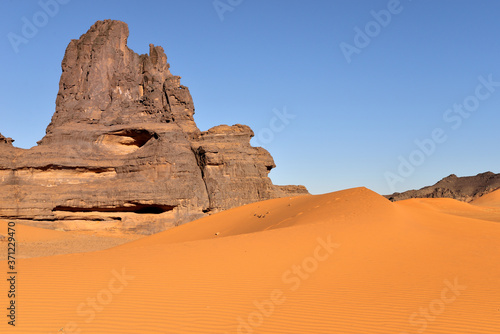 SAHARA DESERT IN ALGERIA. SAND DUNES OF TIN MERZOUGA IN TADRART NATIONAL PARK. 