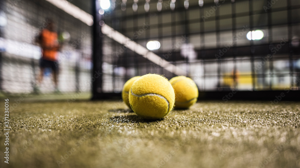Paddle tennis balls in court