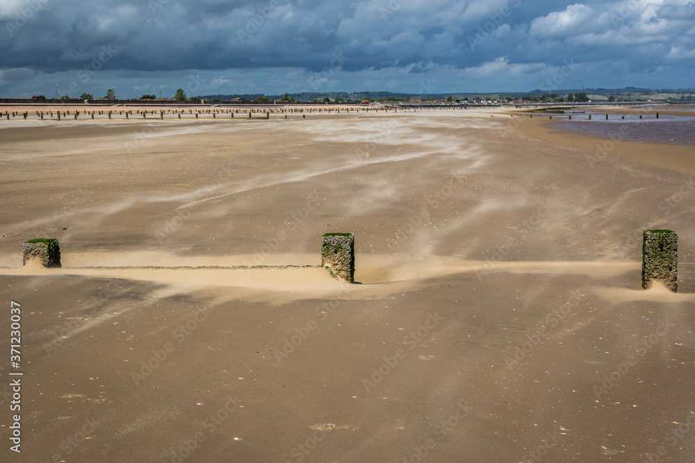 Sandstorm on a deserted beach at Dymchurch, Kent, England Sandstorm on a deserted beach at Dymchurch, Kent, England
