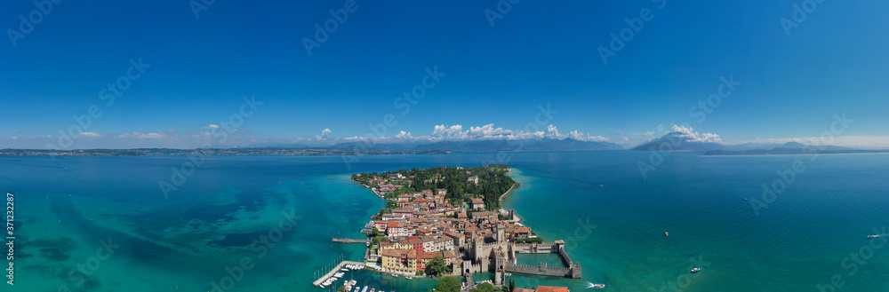 Panoramic views of the city of Sirmione located on the shores of lake Garda.  Aerial view on Sirmione sul Garda. Italy, Lombardy.