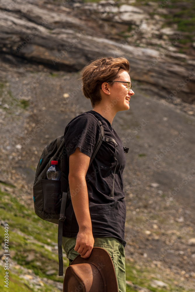 young woman hiking in the mountains young woman hiking in the mountains